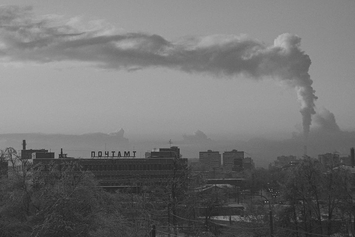 Sunset view from Novogireyevo Bridge in the east of Moscow towards the local postal sorting office and Perovskaya Street, extending in the direction of a large industrial zone that separates the eastern districts of the city from the central part.