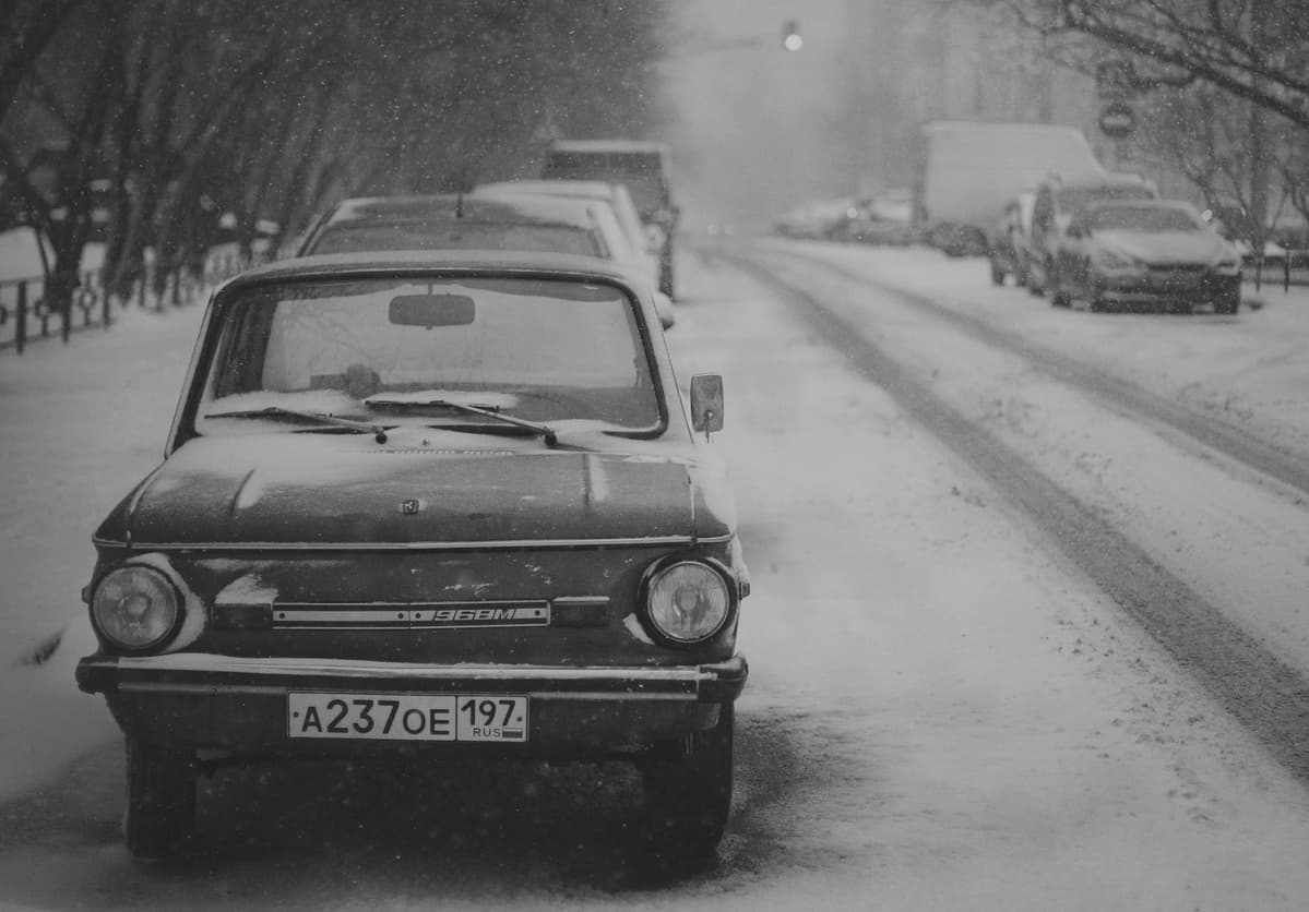 A Soviet Ukrainian-made "Zaporozhets" microcar parked somewhere about Plyushchikha Street in the center of Moscow. Notice how the snow has become dirty along the left side of the parked car (the right side from our point of view).