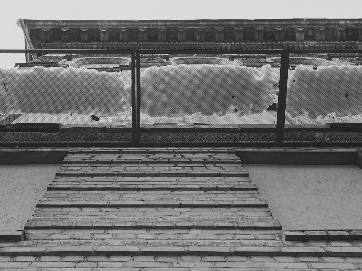 Nets attached to one of the buildings in the center of Kyiv, Ukraine, protect the pavement from falling snow and ice from the roof.
